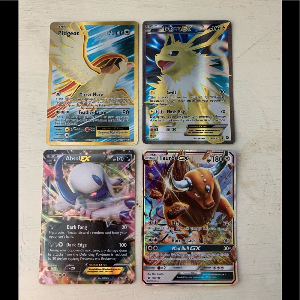 4 Ex/Gx Pokémon cards.